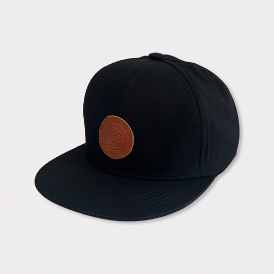 Recycled Collection Black Kids and Adult Flatbill Hat with Leather Patch Angle