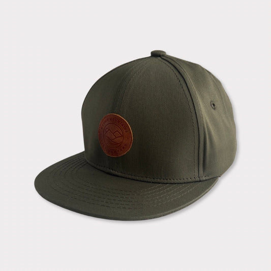 Recycled Collection Earthy Green Kids Flatbill Hat with Leather Patch Angle