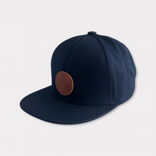 Recycled Collection Navy Kids Flatbill Hat with Leather Patch  Angle